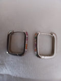 Pendientes de plata rodiada circonitas color