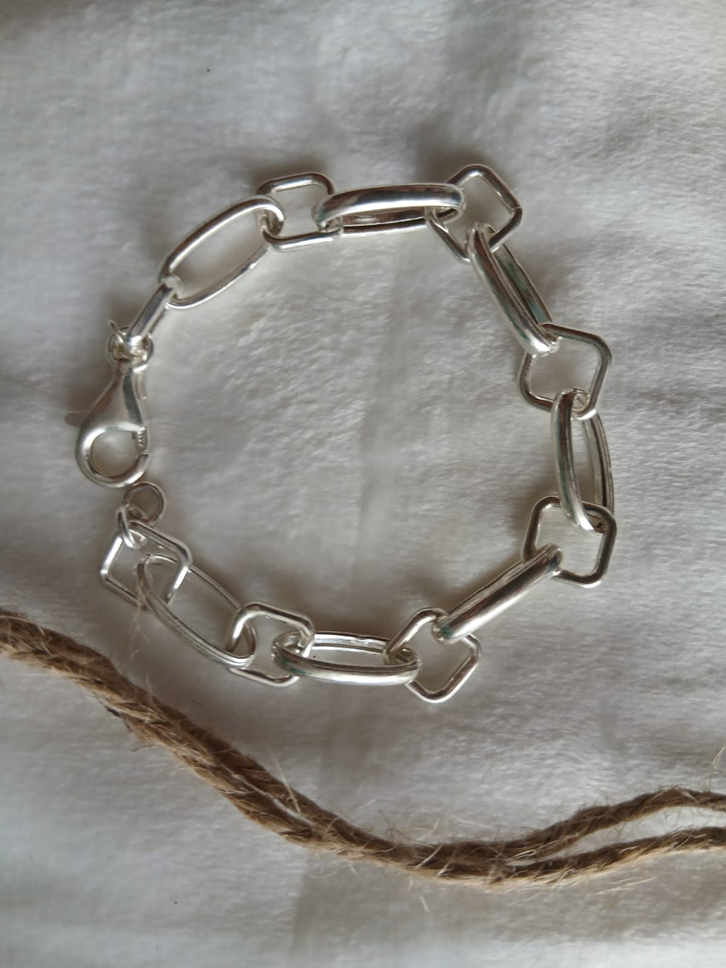 Pulsera plata ley asas huecas